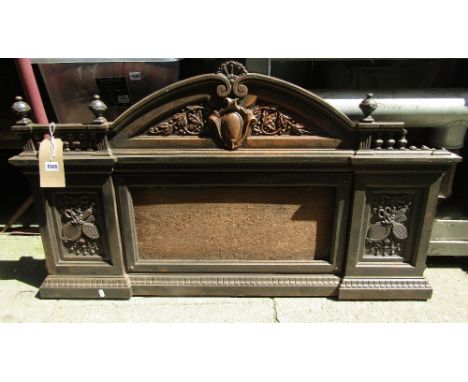 A Victorian cast iron overmantle with architectural pediment and further classical detail surrounding a vacant mirror plate, 