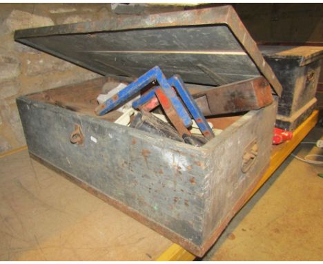 A pine trunk with steel banding containing miscellaneous workshop effects