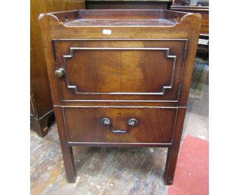 A Georgian mahogany tray top commode, the front elevation enclosed by a panelled door over a pull out base, with three quarte