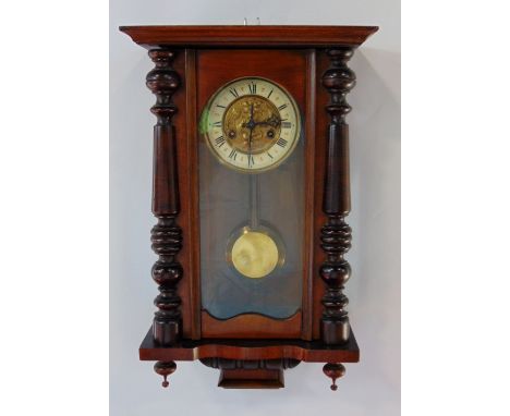 Continental twin train walnut cased wall clock with twin train gilt dial with enamelled chapter ring, 61 cm high