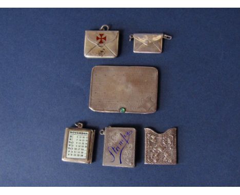 A collection of six silver stamp boxes, two with enamel decoration and an engine turned example with green stained cabochon (