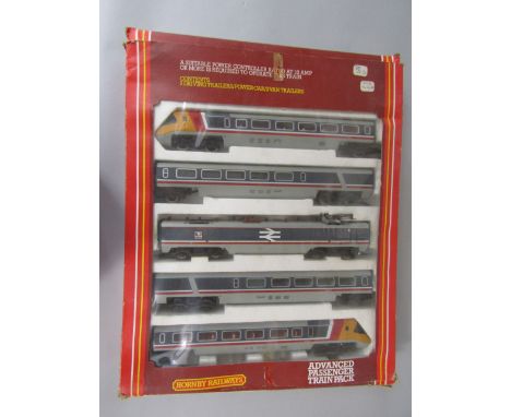 A Hornby Railways R794 Advanced Passenger train pack, containing two driving trailers, power car and two van trailers, with o