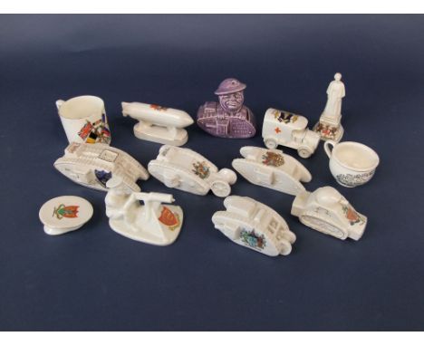 A collection of crested ceramic tanks, Arcadian model of Tommy and his machine gun, a purple glazed money bank in the form of