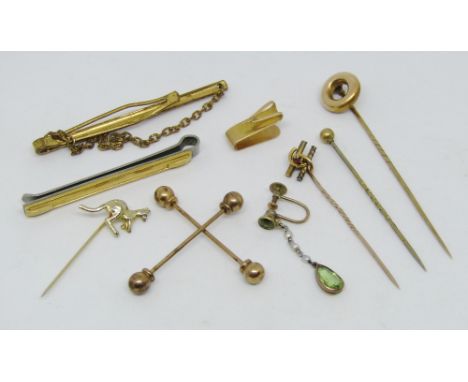 Collection of gold / yellow metal items to include a 15ct stick pin set with a ruby, further 15ct item and a single 9ct drop 