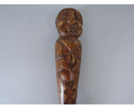 Naturalistic carved walking stick, the knop in the form of a portly gentlemen