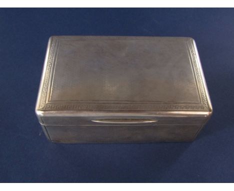 Good quality Mappin &amp; Webb cigarette box, with engine turned decoration and Greek key borders, the hinged lid with gilt i