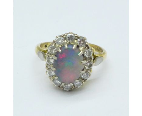 An 18ct gold, opal and diamond cluster ring, 4.6g, N