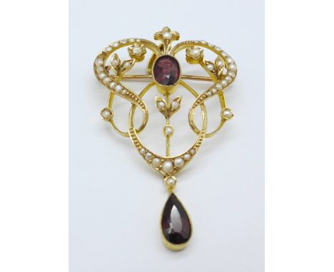 A 9ct gold, garnet and seed pearl pendant or brooch, 6.2g, 5cm