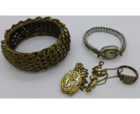 A lady's silver and marcasite wristwatch, a silver ring, a plated pendant, locket and chain and a bangle