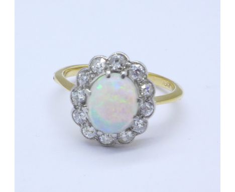 An 18ct gold, opal and diamond ring, 4g, T