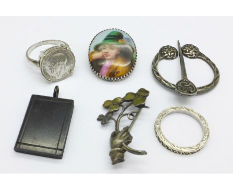 Two silver brooches, one lacking stone, two rings, a pendant and a portrait brooch