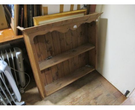 A PINE WALL SHELF the outset moulded cornice above a moulded frieze and two open shelves