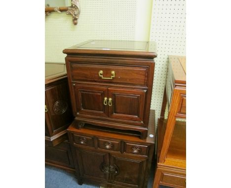 AN ORIENTAL HARDWOOD SIDE CABINET with frieze drawer and cupboards together with a hardwood side cabinet with three frieze dr