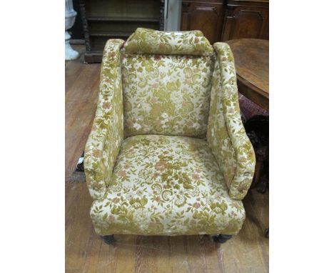 AN EDWARDIAN MAHOGANY DRAWING ROOM CHAIR each with a deep button upholstered back and seat on turned legs