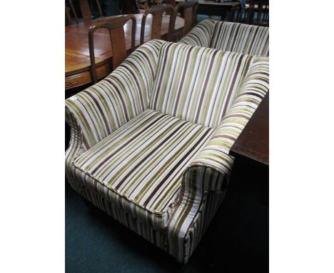 A PAIR OF UPHOLSTERED EASY CHAIRS each with a rectangular back and roll over arms and loose cushion on square moulded legs 95
