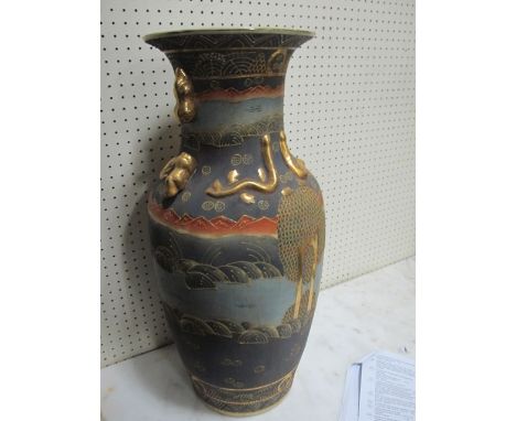 A PAIR OF SATSUMA VASES each of baluster form the light green, grey and gilt ground decorated with figures and stylized anima