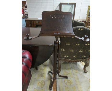 A BEECHWOOD MUSIC STAND with candle sconces raised on tripod support 133cm (h) x 51cm (w) x 11cm (d)