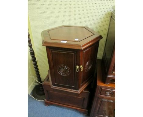 AN ORIENTAL HARDWOOD OCTAGONAL SHAPED PEDESTAL with cupboards together with a hardwood lift top trunk on moulded legs 