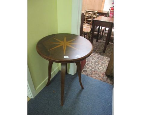 A CONTINENTAL WALNUT INLAID OCCASIONAL TABLE the circular moulded top the sunburst inalid panel raised on moulded splayed leg