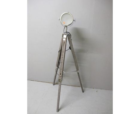 A POLISHED STEEL FLOOR STANDARD LAMP on telescopic tripod base 139cm high