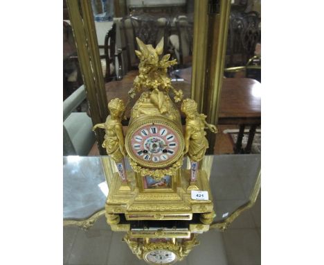 A FRENCH GILT METAL AND PORCELAIN CLOCK 19th Century the painted dial with Roman numerals flanked on each side by figural col