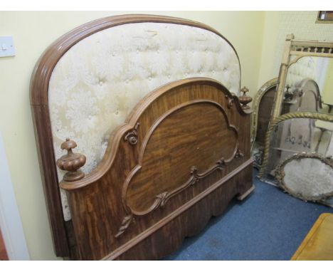 A VICTORIAN MAHOGANY BED the rectangular arched headboard with button upholstered panel above a panel footboard with applied 