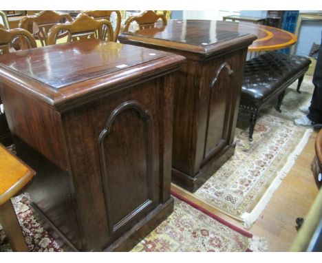 A PAIR OF VICTORIAN MAHOGANY DINING ROOM PEDESTALS each of rectangular form the shaped moulded top above an arched panel door