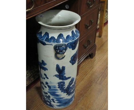 AN ORIENTAL STICK STAND the white and blue ground decorated with flowerheads and foliage with figural handles 56cm (h) x 23cm