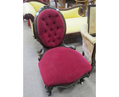 A VICTORIAN MAHOGANY LADIES CHAIR the oval back with foliate flowerhead cresting above a deep button upholstered back and sea