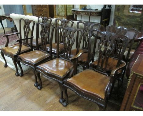 EIGHT CHIPPENDALE STYLE MAHOGANY DINING CHAIRS including a pair of elbow chairs each with a pierced vertical splat above a hi