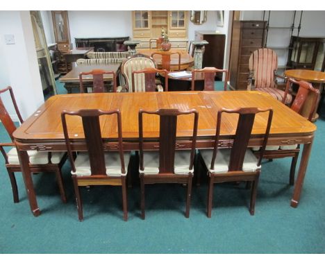 A VERY FINE ORIENTAL HARDWOOD DINING ROOM SUITE comprising eight chairs including a pair of elbow chairs each with a foliate 