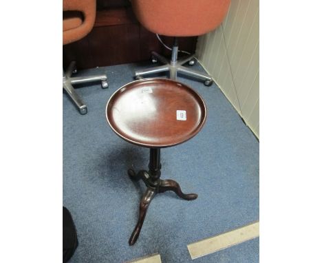 A MAHOGANY WINE TABLE 19th Century the circular dish top above a ring turned column on tripod support 60cm (h) x 27cm (d)