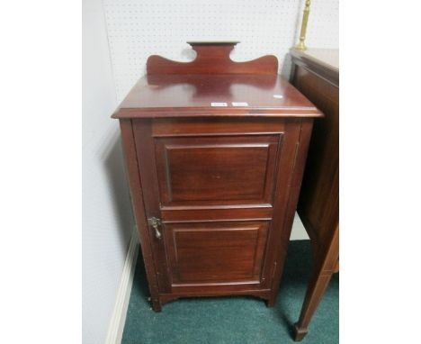 AN EDWARDIAN MAHOGANY CUPBOARD the rectangular top above a panel door on square tapering legs 96cm (h) x 53cm (w) x 42cm (d)