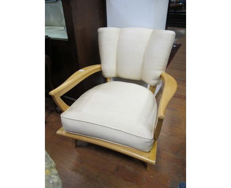 A DESIGNER BEECH FRAME AND UPHOLSTERED ARMCHAIR with upholstered panel and seat on square tapering legs
