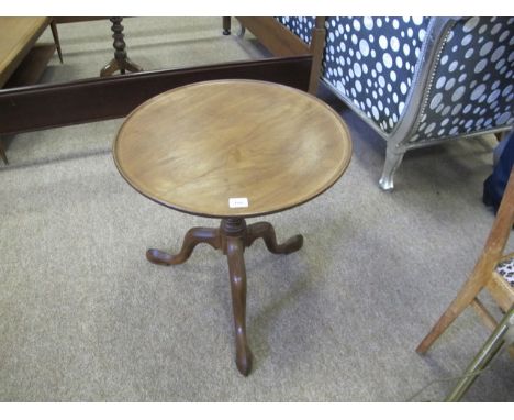 A GEORGIAN MAHOGANY OCCASIONAL TABLE the circular dish top above a baluster column on tripod support 61cm (h) x 60cm (d)