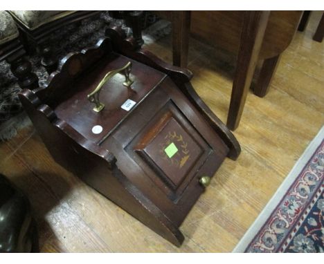 AN EDWARDIAN MAHOGANY COAL SCUTTLE the rectangular hinged lid within a panel on brass carrying handles