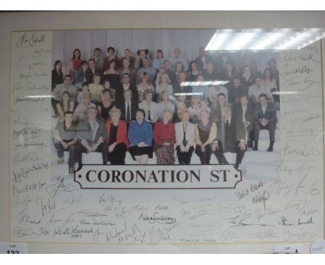 A COLOURED PRINT depicting the coronation street cast with their signatures 28cm x 41cm together with a mahogany fold over ca