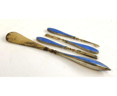A four piece silver gilt and guilloche enamel manicure set, including a shoe horn, by Adderly Bros, Birmingham 1928 