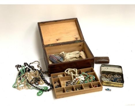 A jewellery box containing various early 20th century bead necklaces, to include make-do necklace, iris glass, faux pearls, C