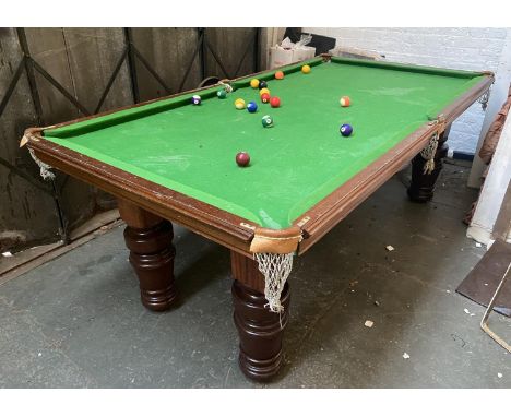 A half size slate billiards table, on substantial turned legs 