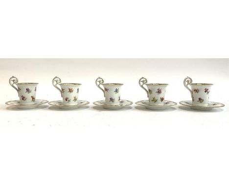 A set of five continental hand painted porcelain coffee cups, 8cmH, and six saucers, 10.5cmD marked with blue crossed swords 