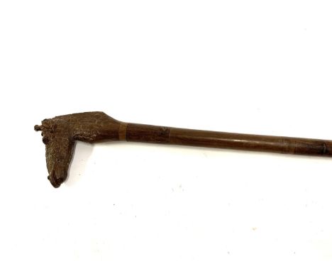 A hardwood walking stick with carved terminal in the form of a giraffe's head, 95cmL 