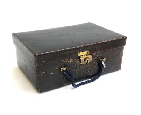 A leather gent's vanity case, the fitted interior containing various pots, brushes, and tweezers, the top monogrammed M. de B
