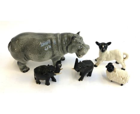 A Melba hippo figurine, 20cmL; together with an unmarked sheep and lamb figurine; and two ebony elephants 