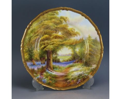 A Royal Worcester plate decorated with a bluebells Kew Garden , signed R. Rushton, 27cm diameter,