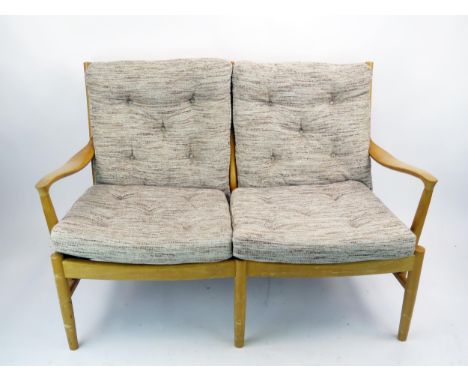 A Parker Knoll two-seater settee, with button down padded cushion seats.