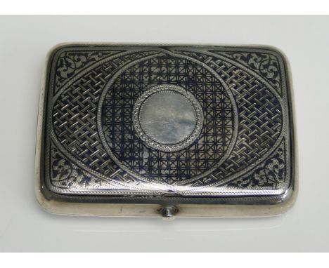 An Imperial Russian silver and niello snuff box of rectangular outline, unmarked but dated 1897, the hinged lid with circular