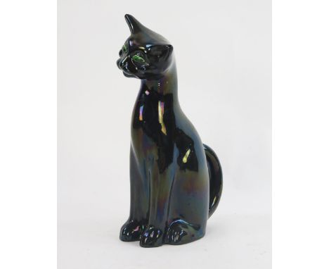 An Arts & Crafts pottery cat with green/black glaze by C H Brannam Barum, Barnstable, height 34cm.