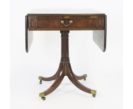 A 19th century mahogany pedestal Pembroke type table, the rectangular top with two drop flaps and moulded edge, with end frie