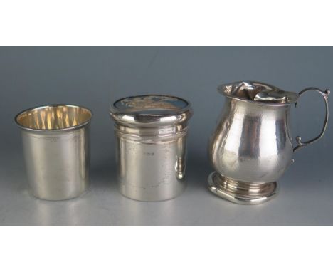 A continental silver tumbler, 8cm high, a silver christening cup, and a silver dressing table jar, 6.5cm high. weighable silv